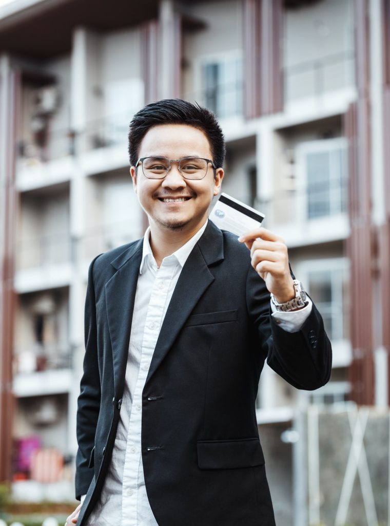 young-handsome-man-enjoy-shopping-online-on-mobile-phone-with-credit-card.jpg